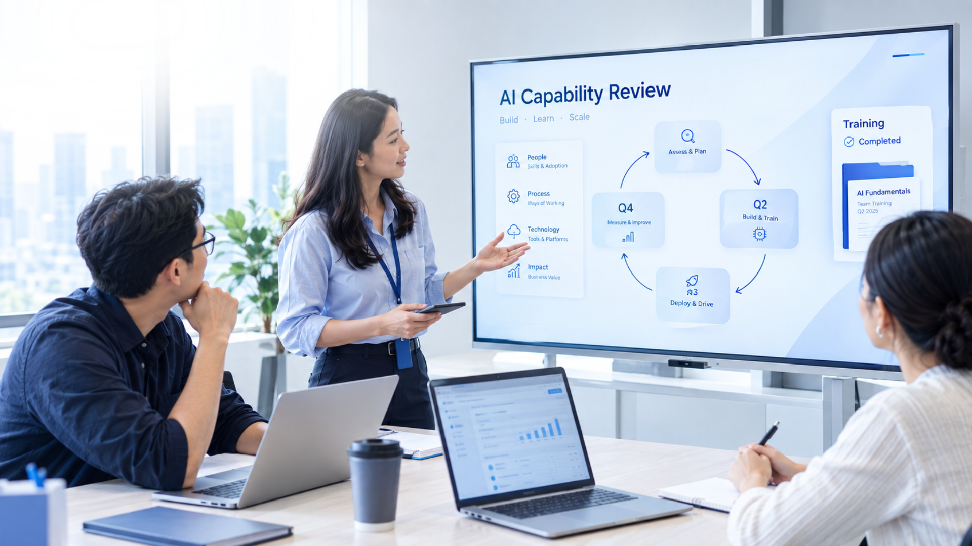 A learning and development leader reviewing a quarterly AI capability review with their team, representing the continuous learning cycle Vision Academy builds organisations around
